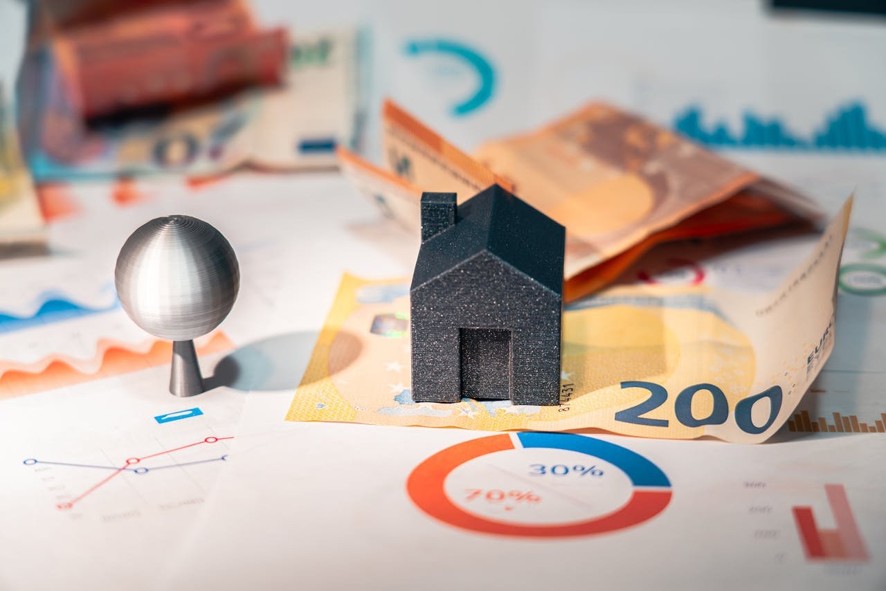 conceptual image of real estate and finance involving euro currency and data charts, symbolizing investment.