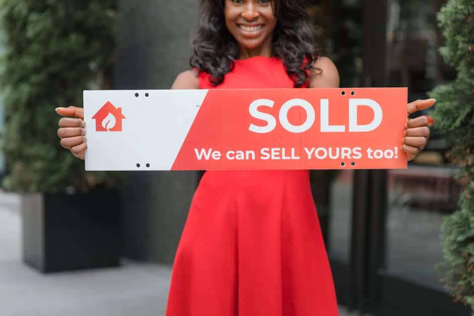 Ai Supercharged Real Estate Investing In 2016 2 A Successful Real Estate Investing Professional Holding A Sold Sign After An AiDriven Closing.